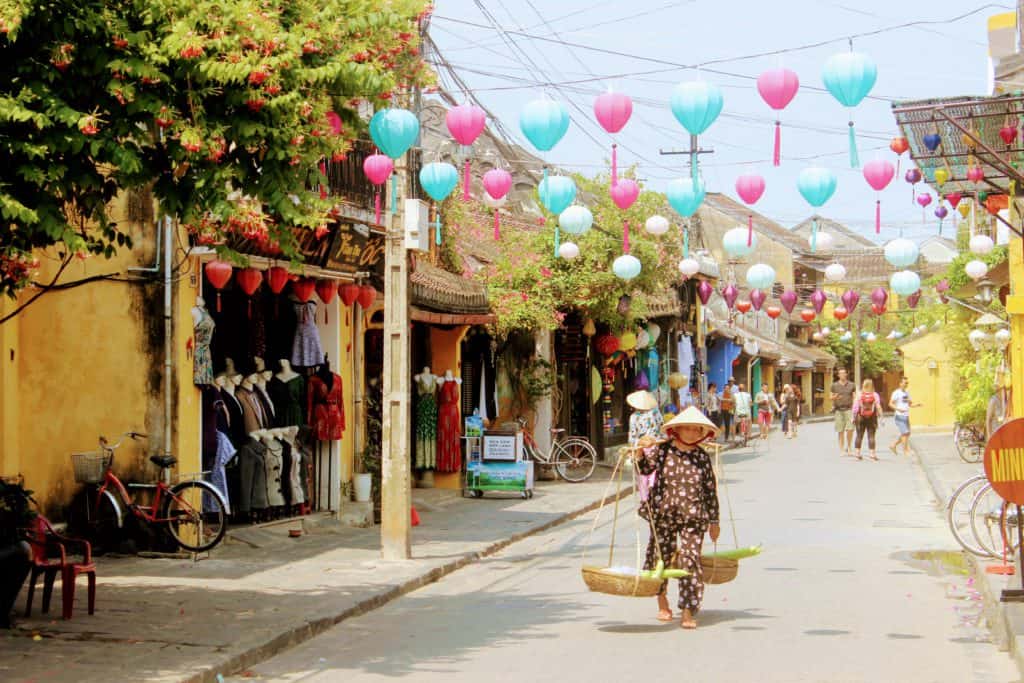 image of woman walking in the old town which is one of the best things to do in Hoi An with kids