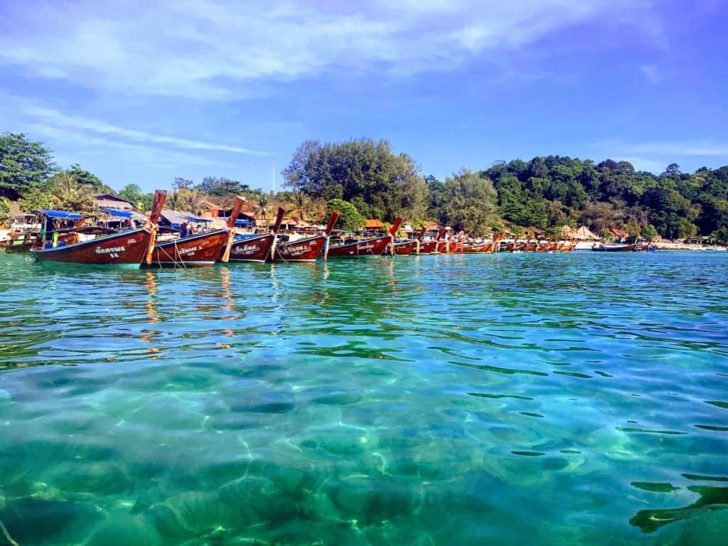 Long tail boats on Pataya beach. A great place to visit in Koh Lipe with kids