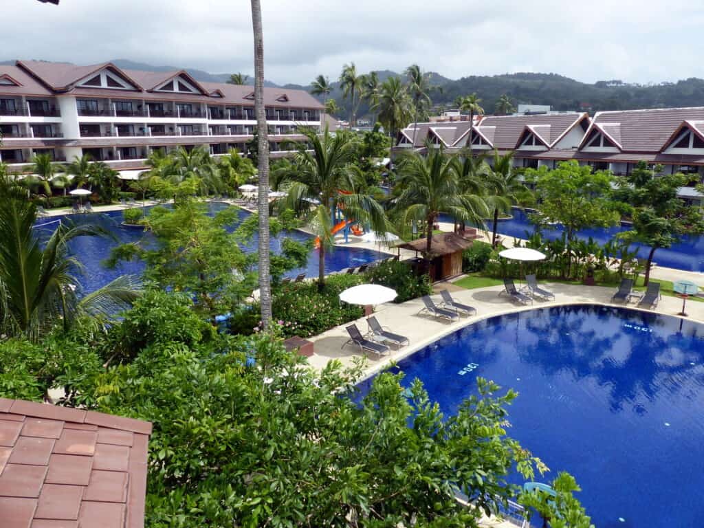 Vies across 2 swimming pools at Sunwing Kamala, one of the best family resorts Phuket