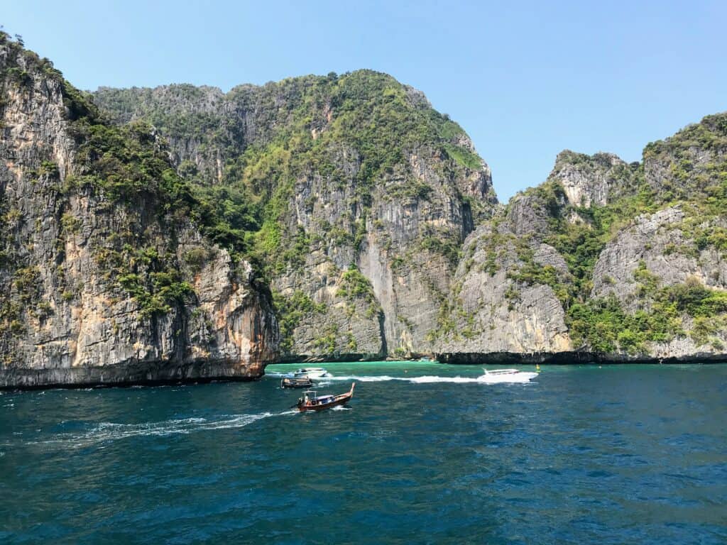 rocky Phi Phi island and boats when snorkelling from Koh Lanta