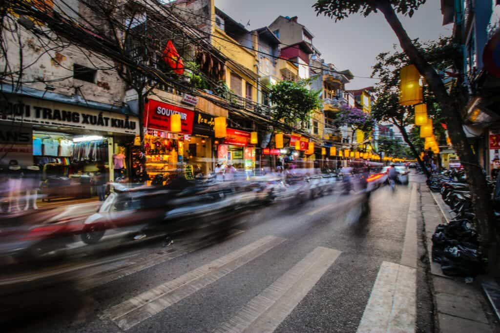 Hanoi street scene long exposure to produce blurred traffic. Hanoi is the start of our 10 day Vietnam itinerary
