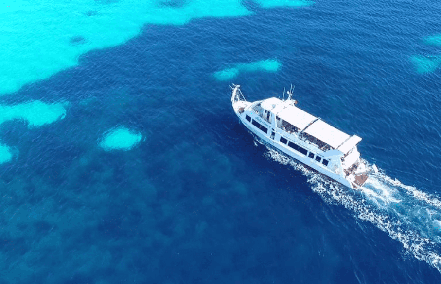 La Maddalena Boat Trip seen from above over blue and turquoise sea