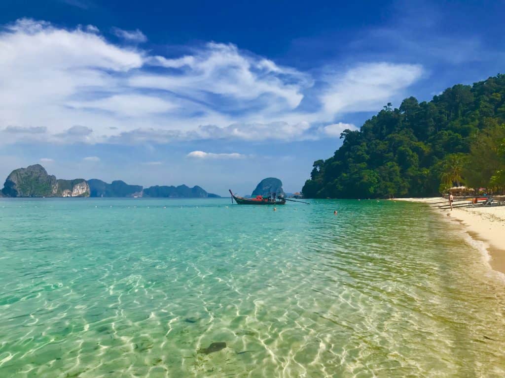 Guide to Koh Ngai Main Beach with view out to sea and karst islands