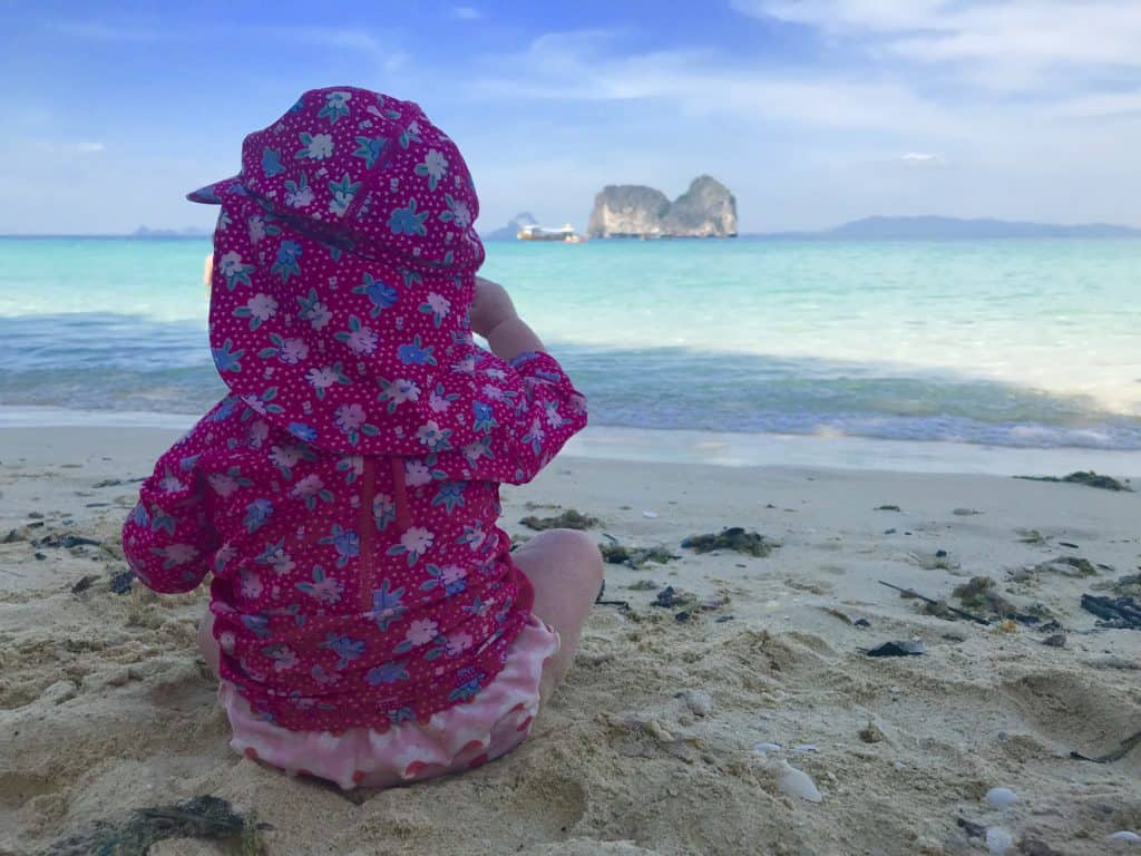 Island in Thailand with a baby sat on the beach