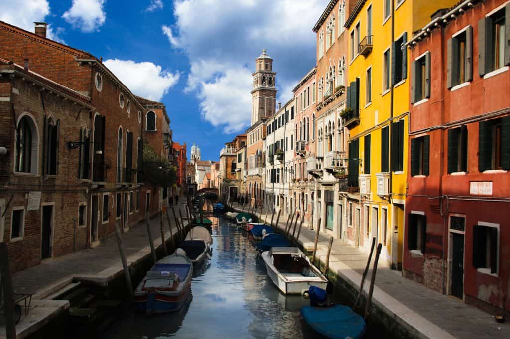 Venice side canal and colourful buildings. How many days in Venice is enough?