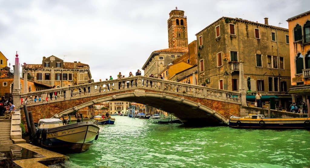 Bridge over the Venice Grand Canal with church tower in the background. How many days in Venice?
