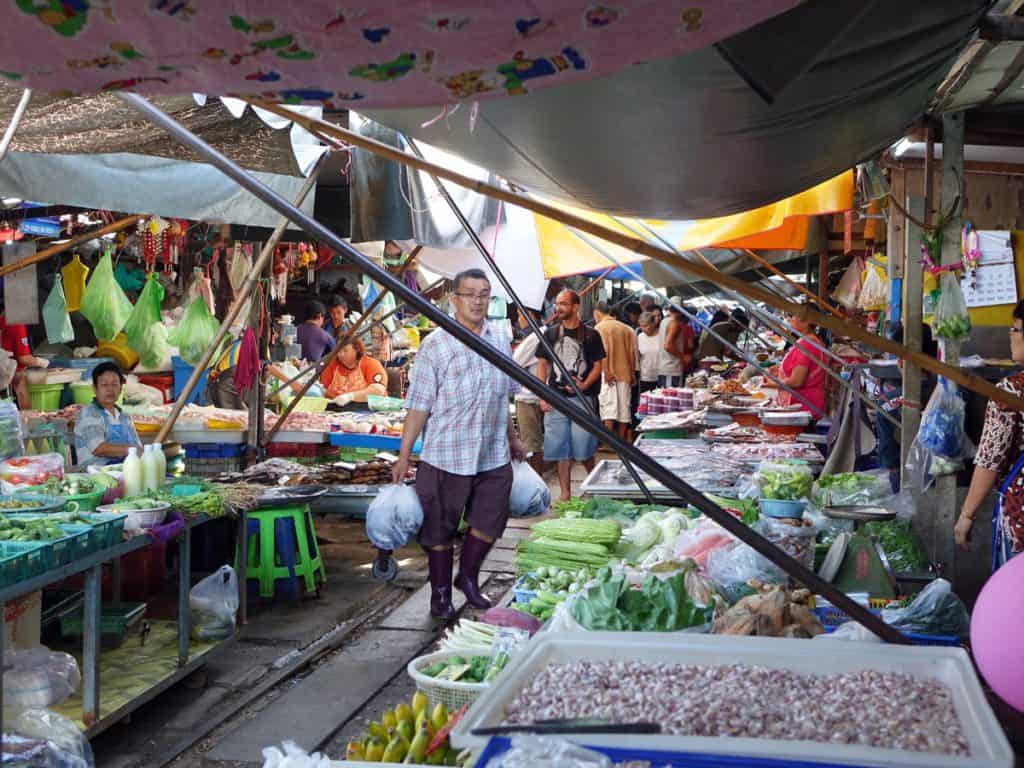 Man walking through the stall of Chatuchak Market oon a Bangkok 4 day itinerary