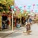 image of woman walking in the old town which is one of the best things to do in Hoi An with kids