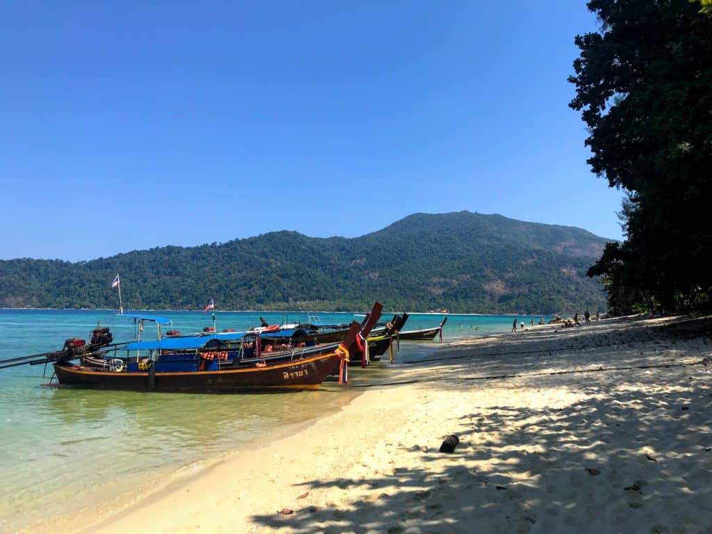 Longtail boats at Sunset Beach Koh Lipe with Kids