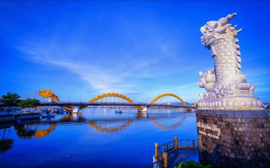 danang dragon bridge reflected in the river as seen on the way from Danang to Hoi An