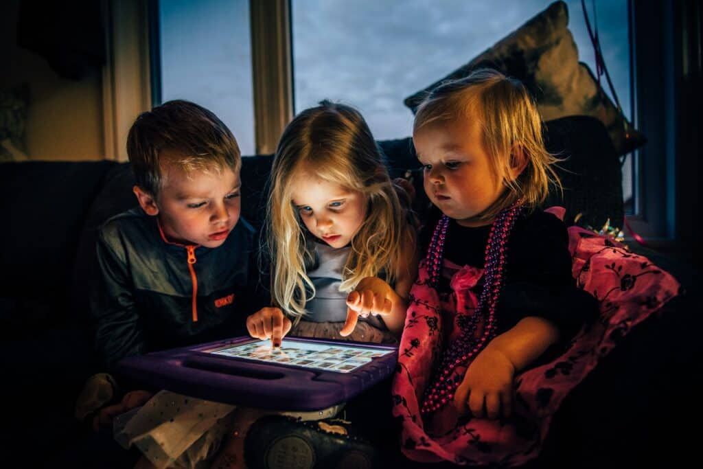 Children Staring at an Amazon Fire Tablet